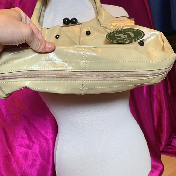 Very unique bag by Suzanne Nichole. Used two times with tag unzips aroun… - Picture 9 of 9